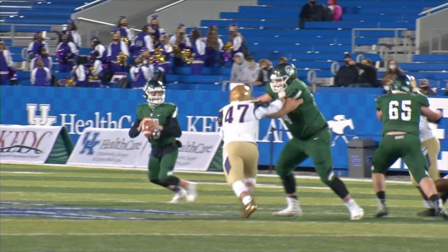 Trinity quarterback Nathan McElroy drops back to pass against Male in the 6A state championship