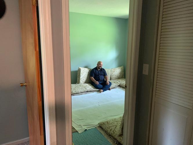 Mohammad in his sitting room.jpg