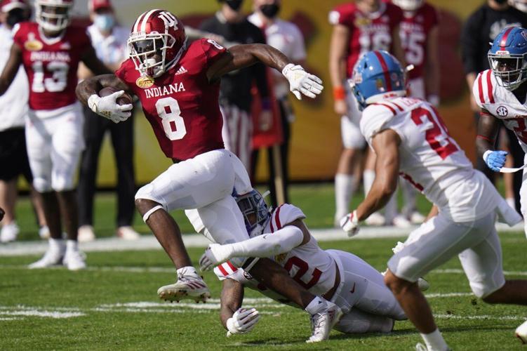 Indiana running back Stevie Scott III (8) slips a tackle by Mississippi linebacker Jacquez Jones