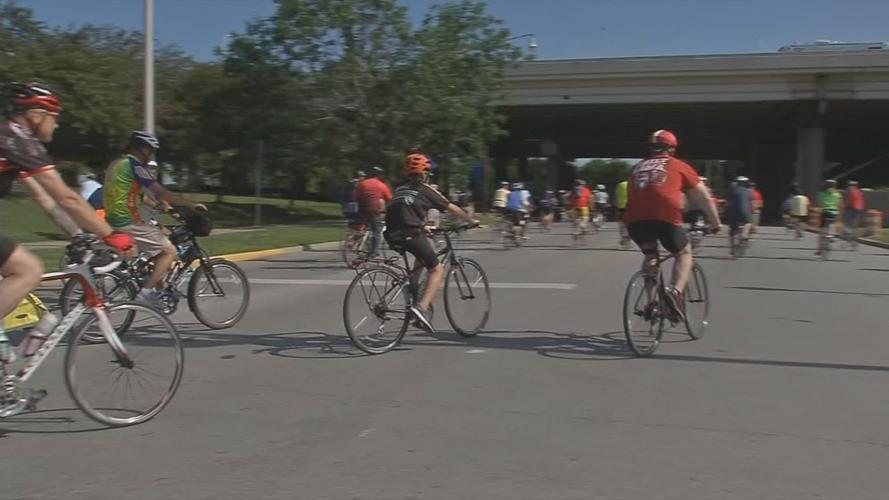 Bikers participating in Hike, Bike and Paddle ride through downtown
