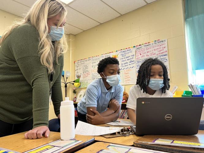 Students break into small groups for Black History Month lessons