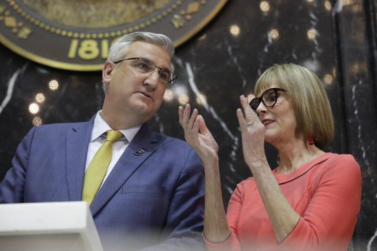 Indiana Gov. Eric Holcomb speaks with Lt. Gov. Suzanne Crouch