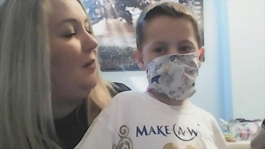 Ashley Brown and Arthur Brown wearing a mask