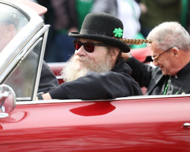Man drives car in parade