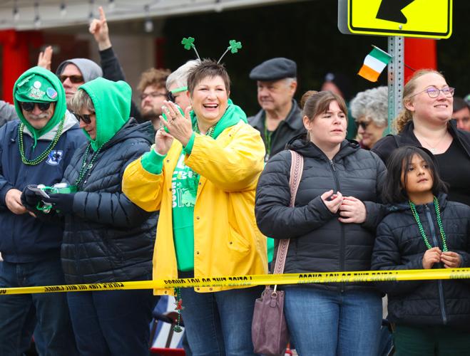 Woman claps during parade in Louisville.JPG