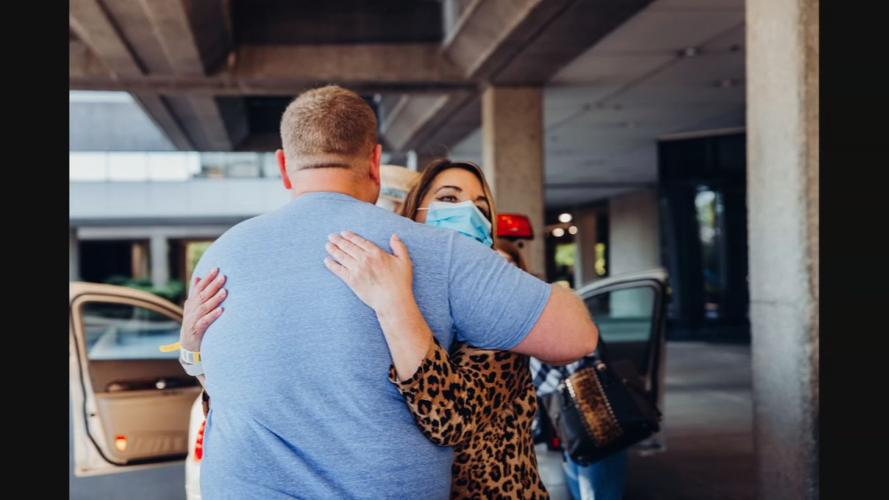 Debbie Whitehouse hugs Baptist worker