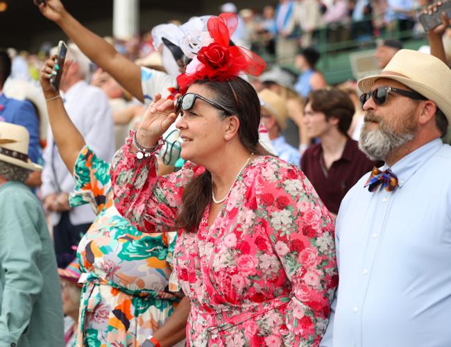 Woman peels up glasses during race.JPG