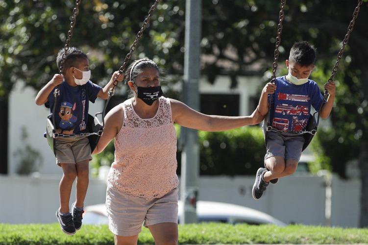 LA-Coronavirus-kids wearing masks-AP.jpeg
