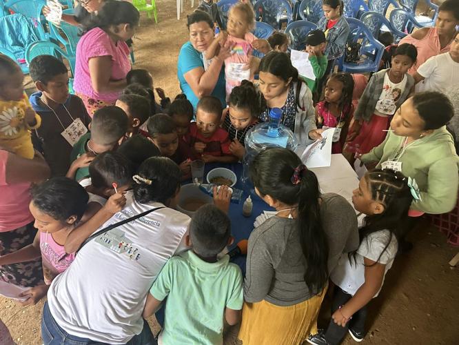 Children in Hondarus drink clean water.jpg
