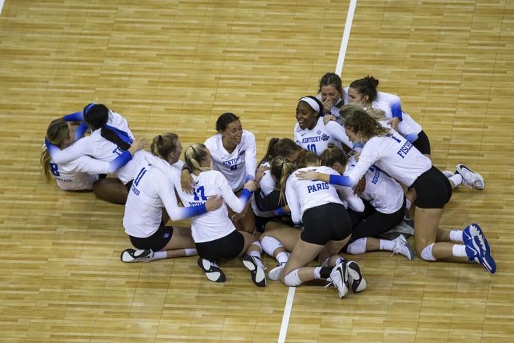 Kentucky players gather on the court after a win over Texas