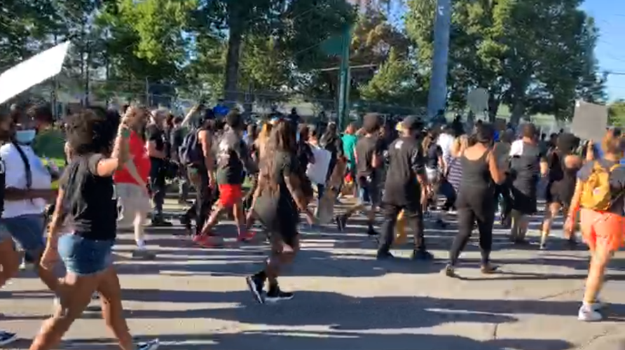 Louisville protesters march outside Churchill Downs on Derby day