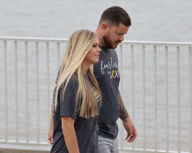 Alexis Carrico walks with Cole Carrico