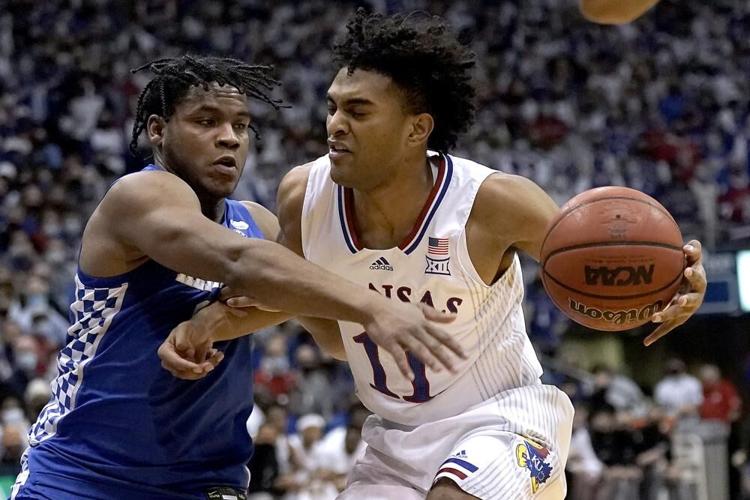 Kansas guard Remy Martin is pressured by Kentucky guard Sahvir Wheeler