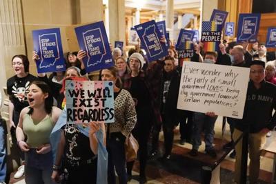Protesters stand outside of the Senate chamber at the Indiana Statehouse - AP FILE.jpg