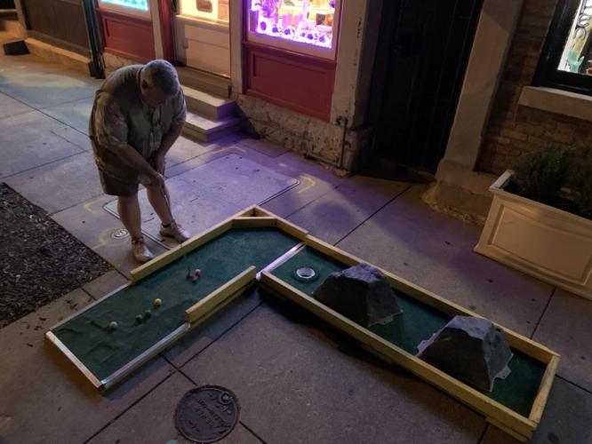 Eric Edwards does putt-putt golf in NuLu