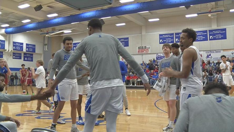 Jay Scrubb rises from the bench as his named is called for the John A. Logan College starting lineup