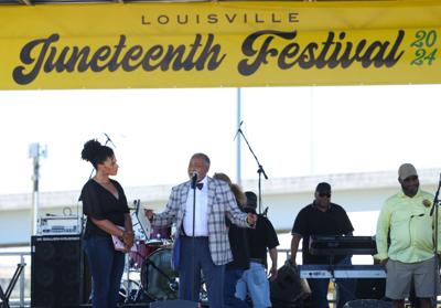 Gerald Neal presents an award to Juneteenth Festival.JPG