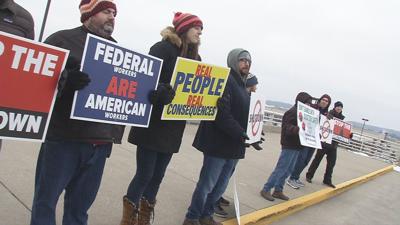 Air traffic controllers at Louisville airport rally against government shutdown