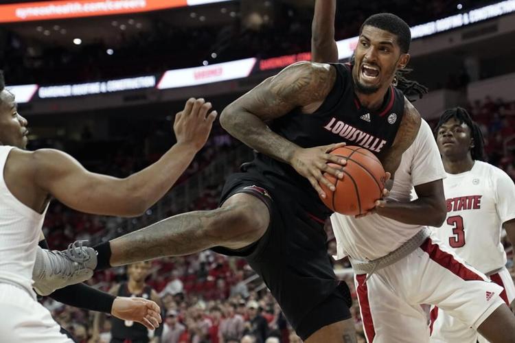 Louisville forward Malik Williams grabs a rebound against North Carolina State.jpeg