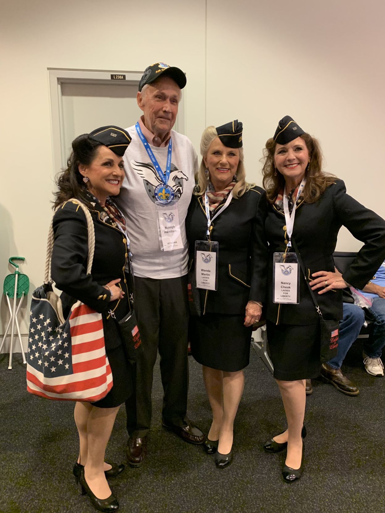 Honor Flight Sept. 2019 vet with singers-2.jpg