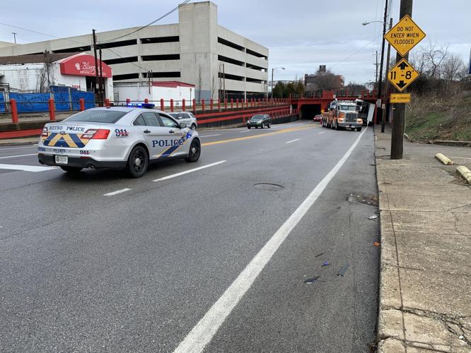 Truck stuck under overpass
