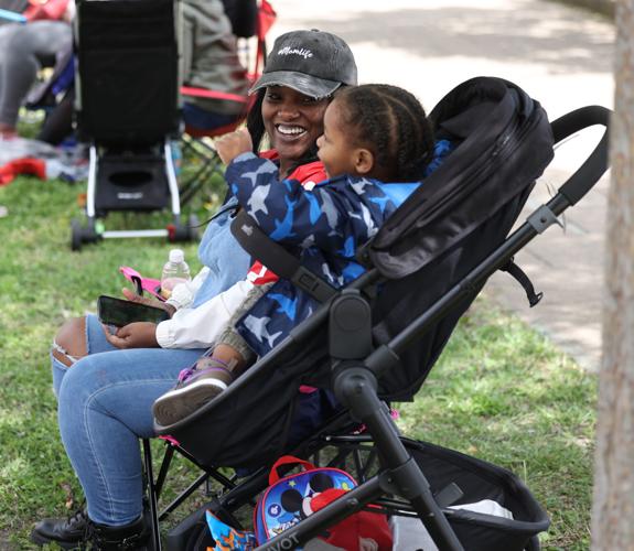 Child looks at mother at parade.JPG