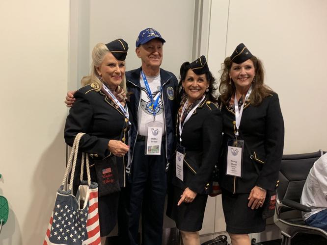 Honor Flight Sept 2019 vet with singers.jpg
