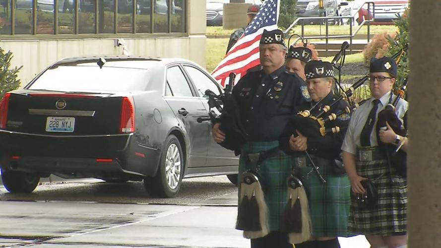 Bagpipe player at funeral for Det. Deidre Mengedoht