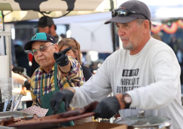 Louisville's Great Chili Cook off - vendor pointing.JPG