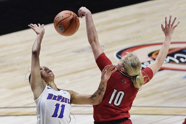 Louisville's Hailey Van Lith, right, blocks a shot attempt