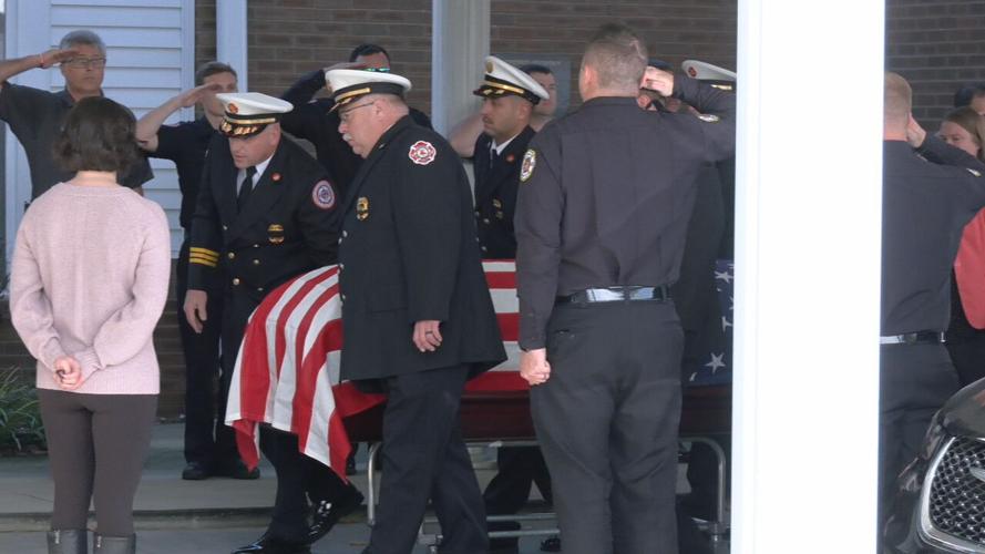 Tom Petschke body loaded into hearse