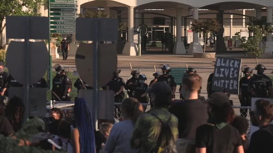 Protesters gather outside Churchill Downs during Derby