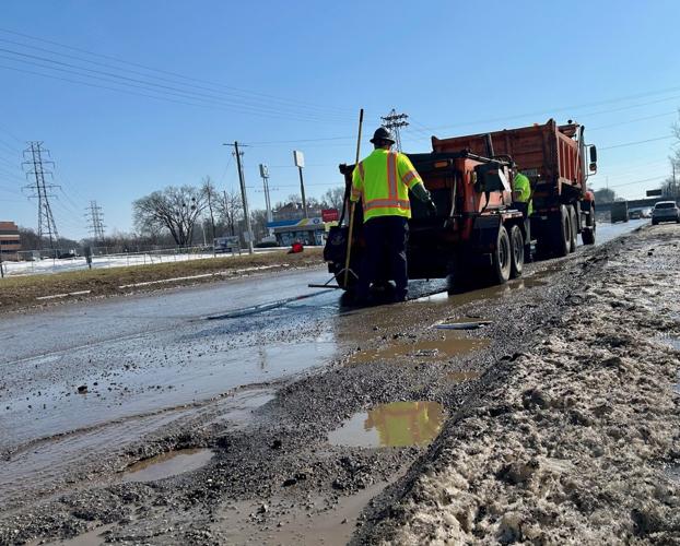 CREWS WORKING ON POTHOLES AFTER WINTER STORM 4.jpg