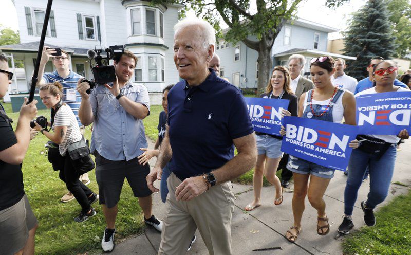 Biden walks with supporters in Iowa