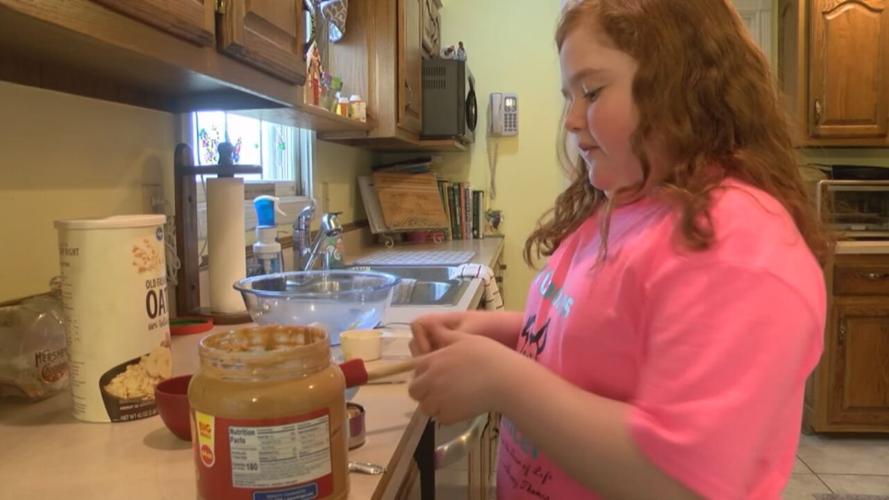 Raelyn Duncan baking dog treats.jpeg