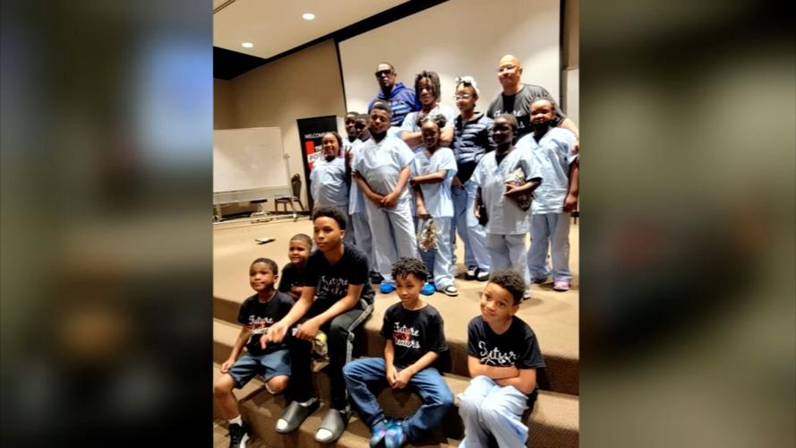 Master P with children taking part in Christopher 2X's Future Healers program
