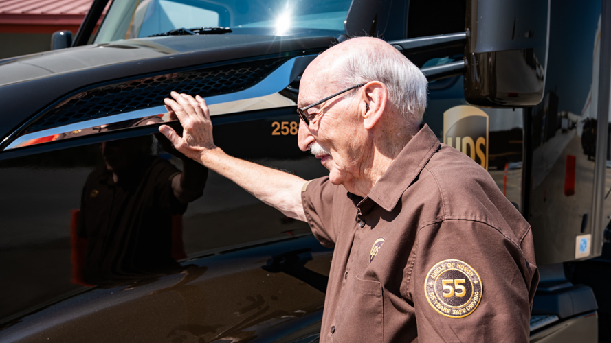 Cleve Francis leans on tractor-trailer