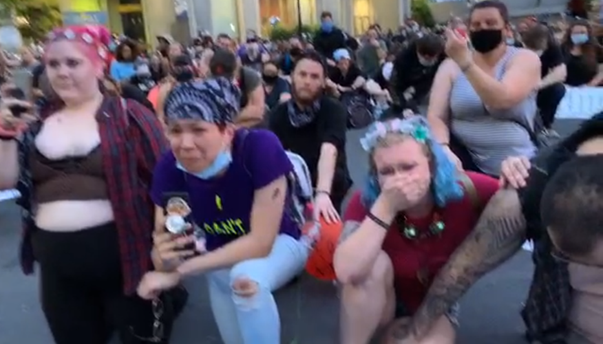 Protesters break during during moment of silence at 6-5-2020 protests