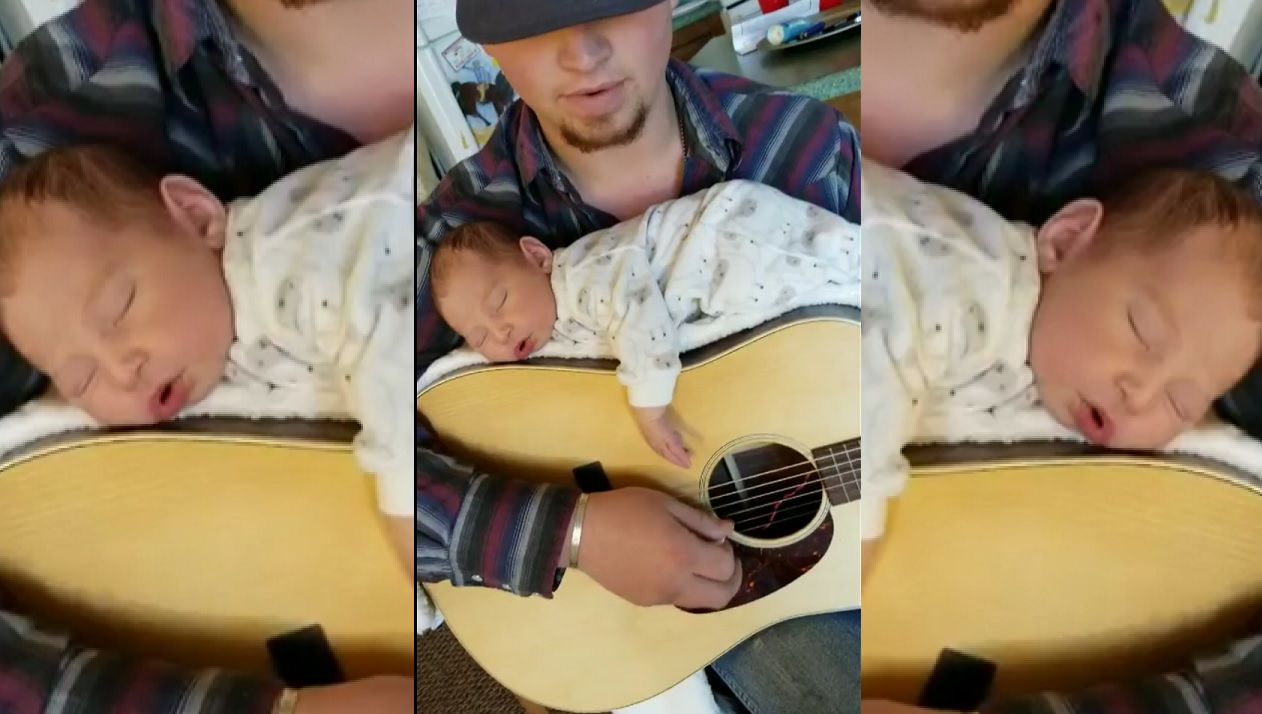 Baby sleeping on store guitar