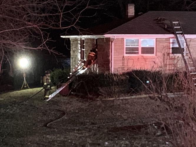 Old Preston Hwy fire firefighter entering home 01.18.2024.jpg