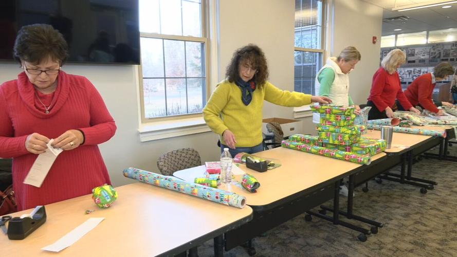 Volunteers wrap gifts at Kosair Charities