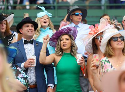 Woman cheers in Section 124 during race.JPG