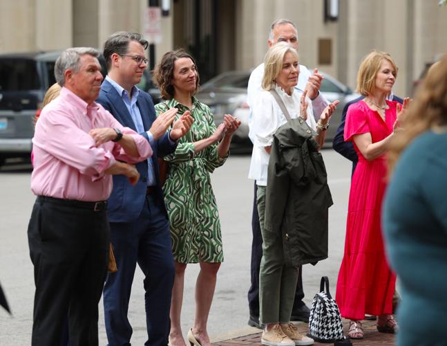 Crowd claps for Hometown Heroes banner.JPG