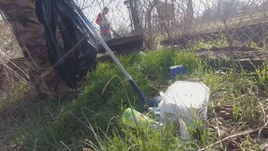 Participants pick up litter as part of the Another Way program