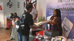 Louisville groups honor gun violence victim with shoe giveaway, anti-violence pledge