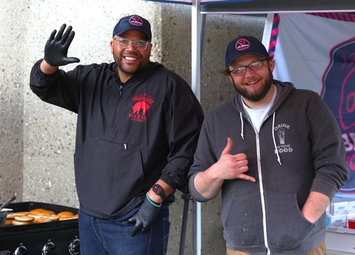 Vendors wave to camera.JPG