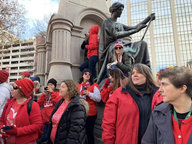 GO RED FOR ED - Teachers Near Statue.jpg