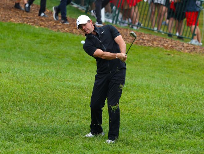 Rory McIlroy chips on practice range.JPG