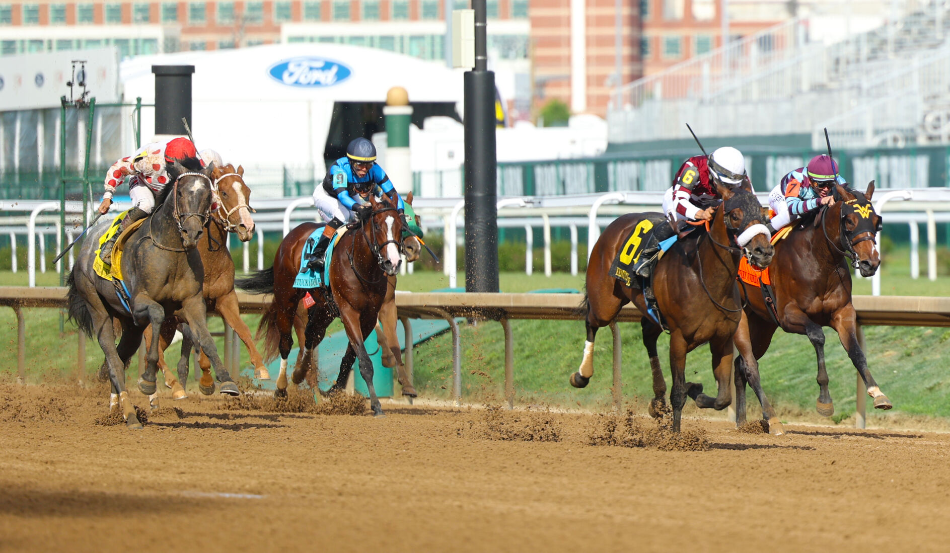 Horses move down stretch at Thurby.JPG
