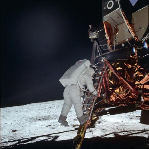 Buzz Aldrin Jr. descends a ladder
